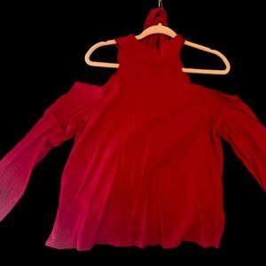 Red high neck with tie down the back with long sleeves and open shoulders